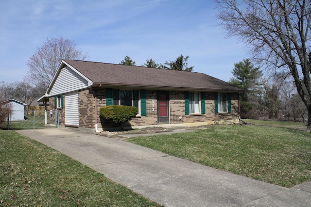 single story home featuring a front lawn, concrete driveway, brick siding, and a shingled roof