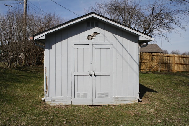 view of shed with fence