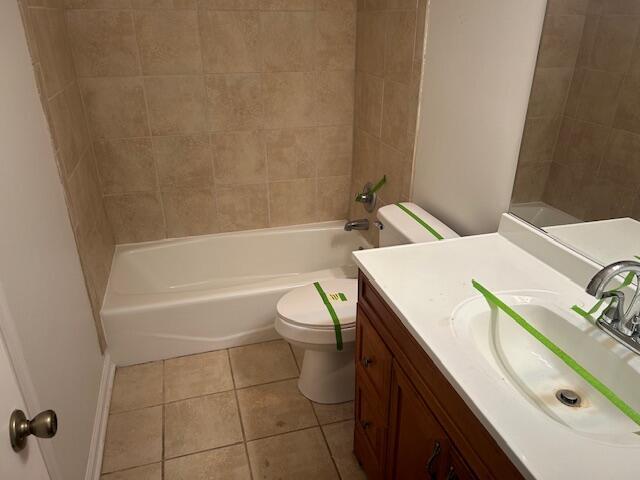 full bath with vanity, tile patterned floors, toilet, and bathtub / shower combination