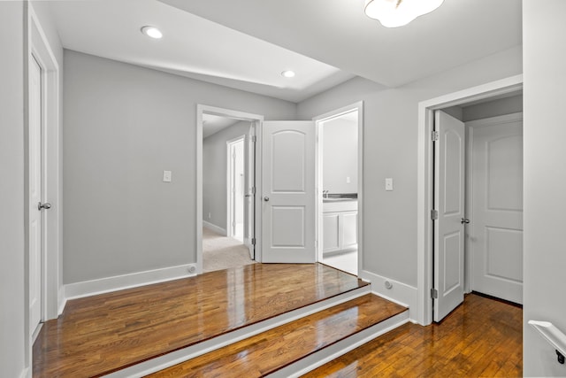 hall with recessed lighting, baseboards, and hardwood / wood-style floors