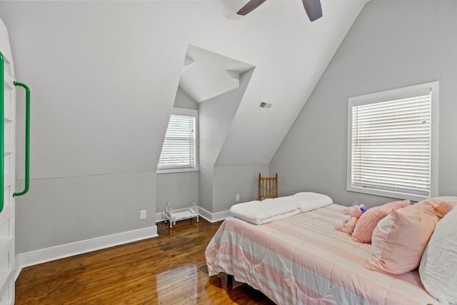 bedroom with visible vents, ceiling fan, baseboards, lofted ceiling, and hardwood / wood-style floors