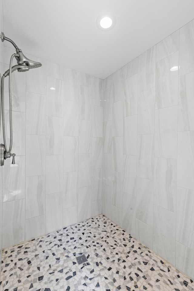 full bathroom with a tile shower