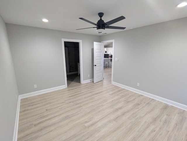 unfurnished bedroom featuring recessed lighting, light wood-type flooring, baseboards, and ceiling fan