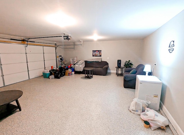 garage featuring a garage door opener and baseboards