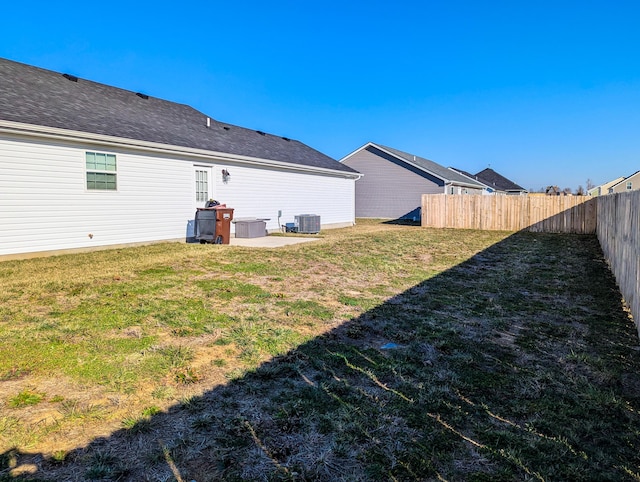 view of yard featuring cooling unit and a fenced backyard