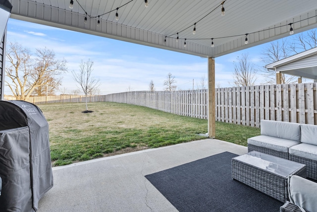 view of patio with outdoor lounge area, a fenced backyard, and grilling area