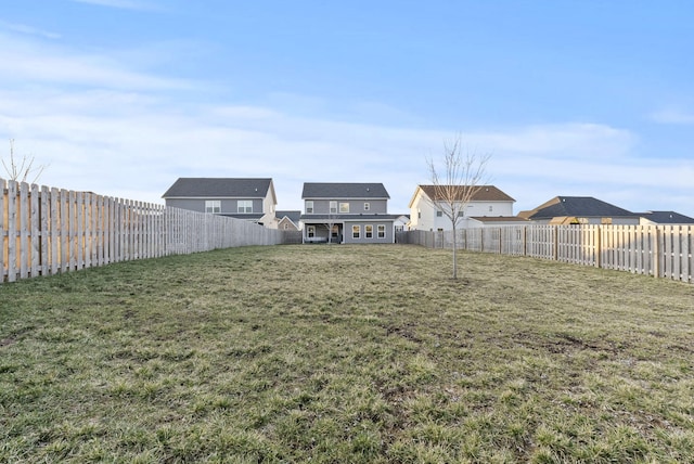 view of yard with a fenced backyard