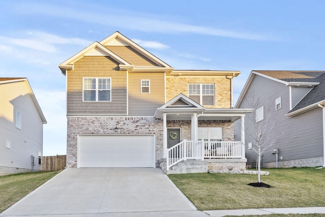 craftsman-style home with brick siding, a porch, a front yard, a garage, and driveway