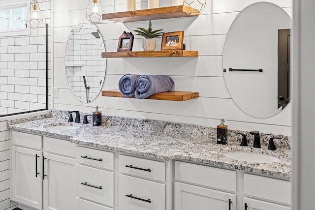 bathroom with double vanity and a sink