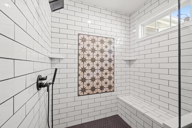 full bathroom with a tile shower