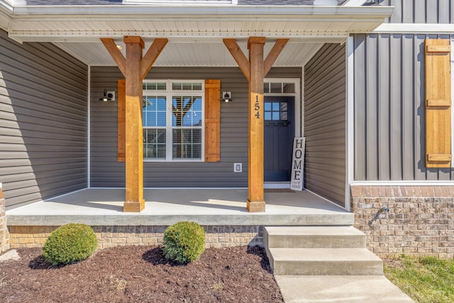 property entrance with a porch and board and batten siding