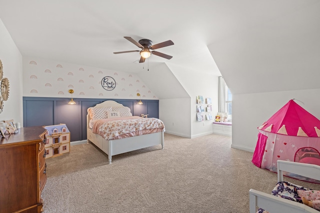 carpeted bedroom with baseboards, ceiling fan, and vaulted ceiling