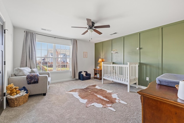 bedroom featuring visible vents, baseboards, a ceiling fan, and carpet flooring