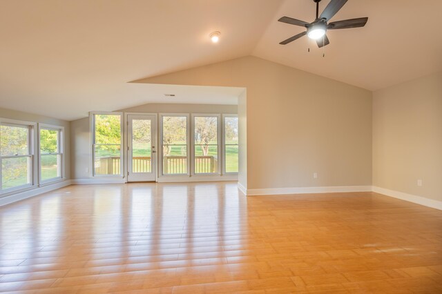 unfurnished living room with light wood-type flooring, visible vents, french doors, baseboards, and a brick fireplace