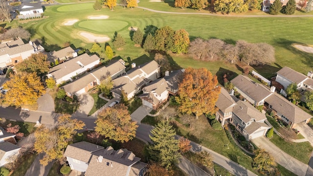 drone / aerial view featuring a residential view and golf course view