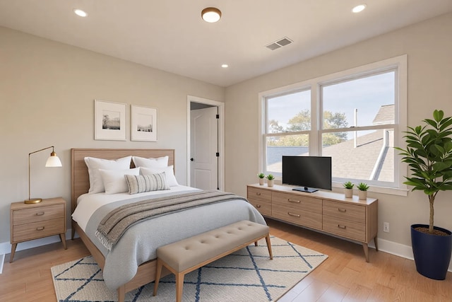 bedroom featuring visible vents, recessed lighting, light wood-type flooring, and baseboards