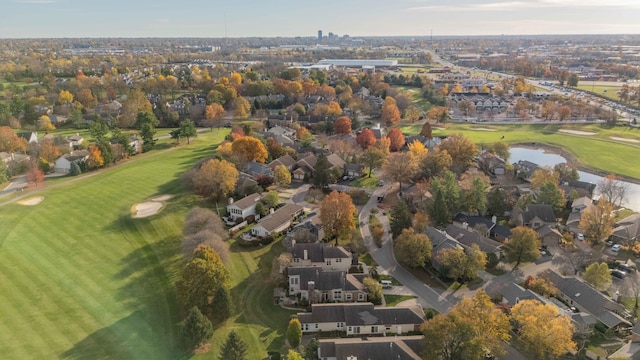 aerial view with a residential view, a water view, and view of golf course