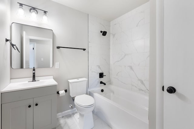 bathroom featuring baseboards, washtub / shower combination, toilet, marble finish floor, and vanity