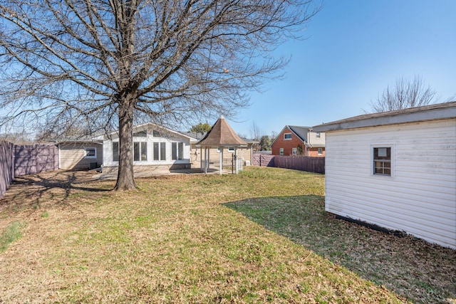 view of yard with a fenced backyard and an outdoor structure