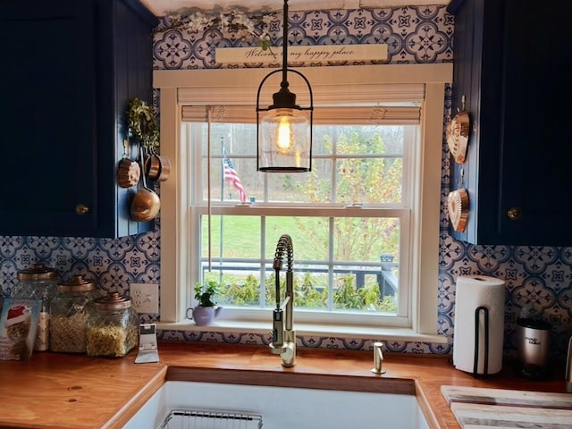 interior details with blue cabinetry and wooden counters