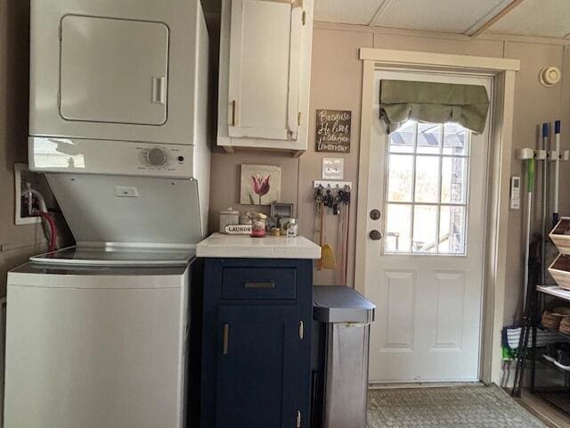 laundry room featuring stacked washer / dryer