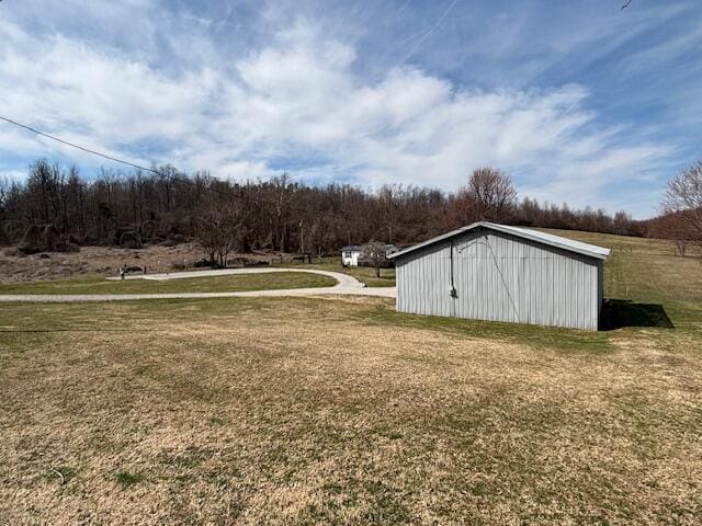 view of yard with an outbuilding and a pole building