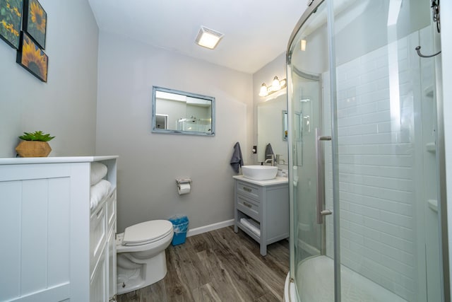 285 Hill Rd, Somerset, KY 42501 - bathroom featuring a shower stall, baseboards, toilet, wood finished floors, and vanity