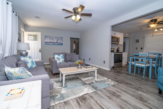 285 Hill Rd, Somerset, KY 42501 - living area featuring visible vents, baseboards, ceiling fan, and wood finished floors