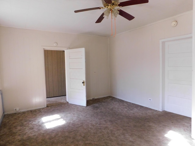 unfurnished room with carpet floors and a ceiling fan