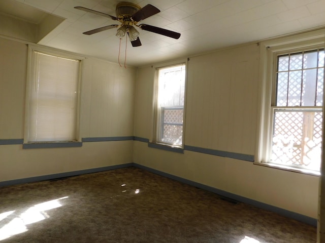 unfurnished room with visible vents, carpet floors, and baseboards