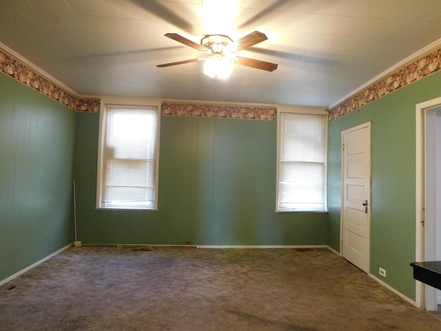 empty room with baseboards, plenty of natural light, carpet, and ceiling fan