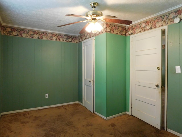 unfurnished room featuring ceiling fan, carpet flooring, and a textured ceiling