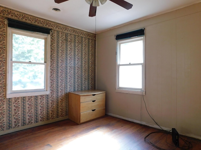 unfurnished bedroom featuring visible vents, ceiling fan, light wood-type flooring, and baseboards