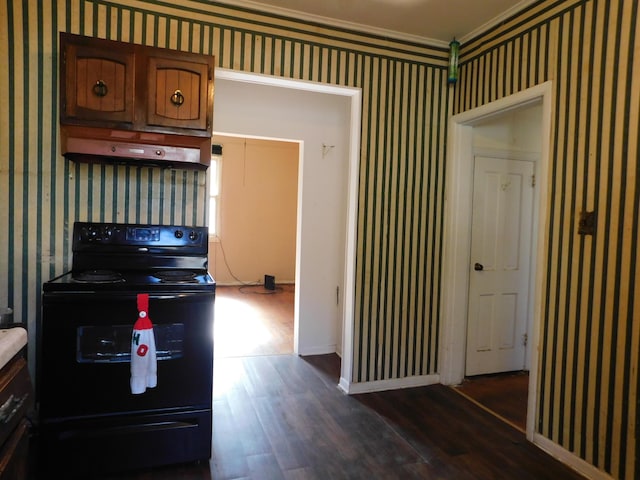 kitchen featuring wallpapered walls, exhaust hood, black range with electric stovetop, and dark wood-style flooring