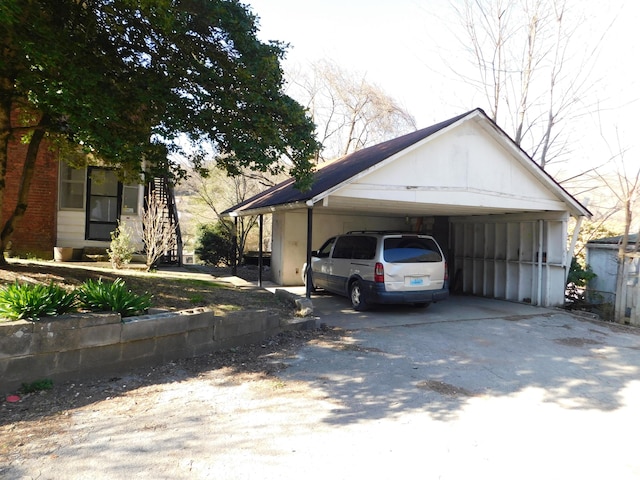 exterior space with a carport and driveway