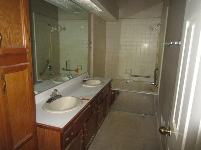 bathroom featuring a sink, double vanity, and  shower combination