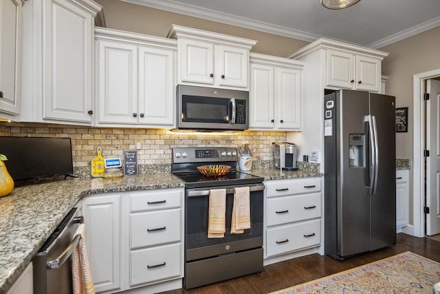 kitchen featuring dark wood-style flooring, stainless steel appliances, white cabinets, crown molding, and backsplash