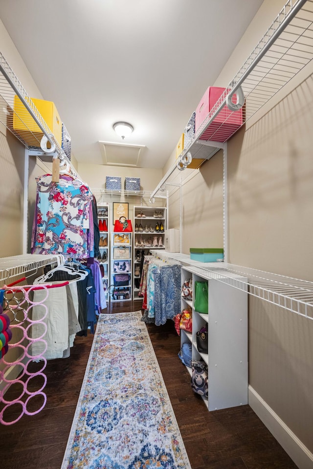 spacious closet featuring attic access and wood finished floors