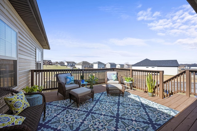 wooden deck with a residential view and an outdoor hangout area