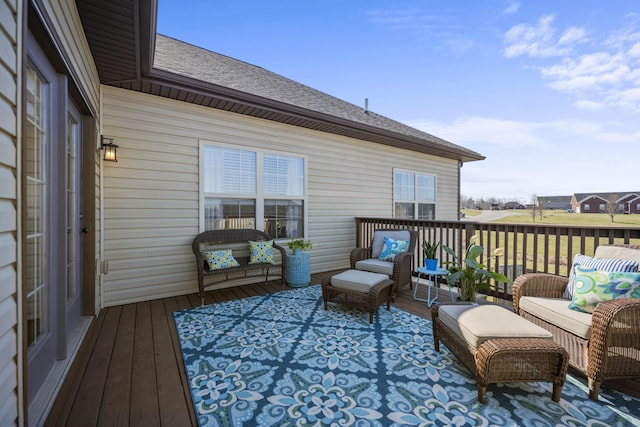 wooden terrace featuring an outdoor living space