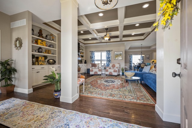 living room with visible vents, dark wood-type flooring, baseboards, coffered ceiling, and a ceiling fan