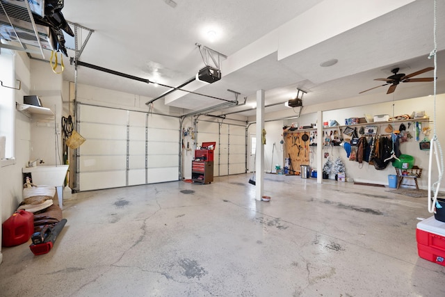 garage featuring a ceiling fan and a garage door opener