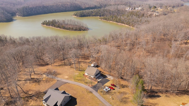 bird's eye view with a wooded view and a water view