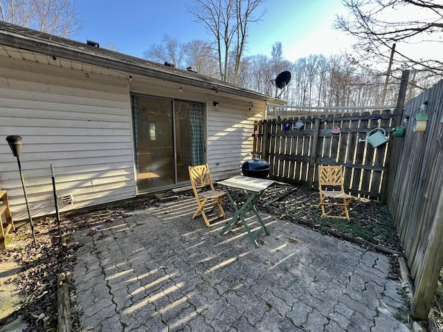 view of patio / terrace featuring fence