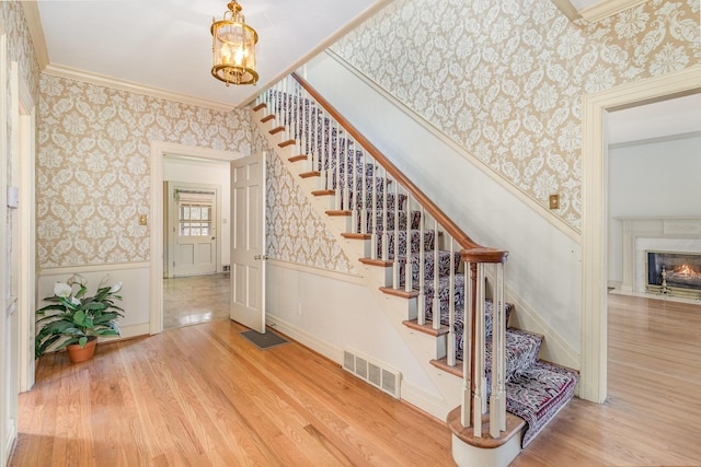 2136 Adena Ln, Lexington, KY 40516 - stairs featuring a wainscoted wall, visible vents, and wallpapered walls