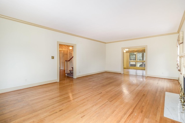2136 Adena Ln, Lexington, KY 40516 - unfurnished room with stairway, light wood-style floors, baseboards, and ornamental molding