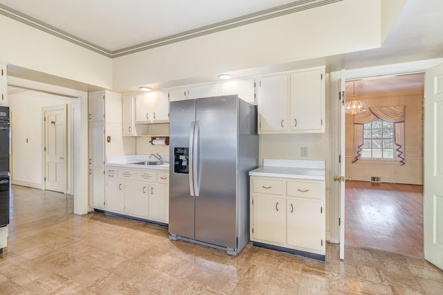2136 Adena Ln, Lexington, KY 40516 - kitchen featuring oven, ornamental molding, a sink, stainless steel fridge with ice dispenser, and light countertops