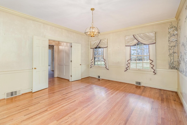 2136 Adena Ln, Lexington, KY 40516 - unfurnished room featuring visible vents, an inviting chandelier, wood finished floors, and crown molding