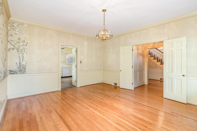 2136 Adena Ln, Lexington, KY 40516 - spare room featuring light wood finished floors, visible vents, crown molding, a chandelier, and a wainscoted wall