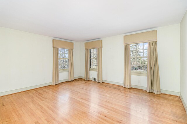 2136 Adena Ln, Lexington, KY 40516 - empty room featuring baseboards, a healthy amount of sunlight, and light wood finished floors